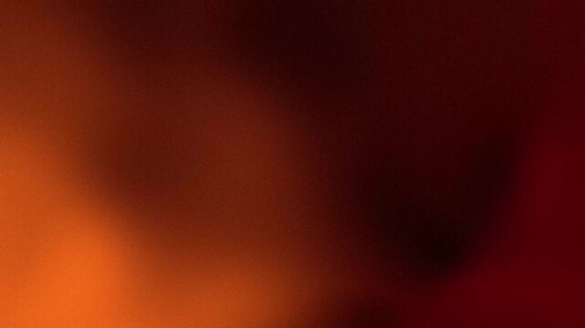Smooth blurred orange and dark red gradient background with warm tones for abstract artistic visual design