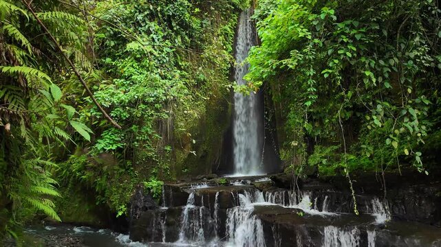 Vivid representation of Bali waterfall showcases its breathtaking beauty, surrounded by rich tropical vegetation and serene ambiance
