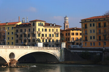 View across the River Adige near Ponte della Vittoria to Torre dei Lamberti in Verona, Italy
