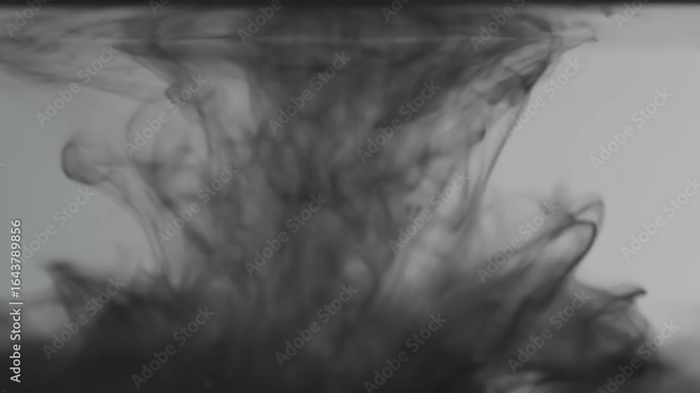 Poster abstract ink diffusion in water - macro shot of black ink drops merging and diffusing in clear water