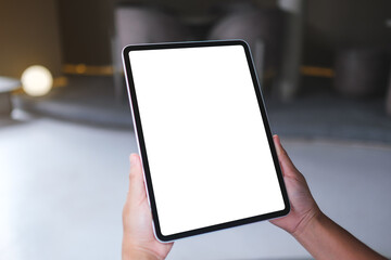 Mockup image of a woman holding digital tablet with blank white desktop screen
