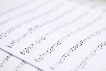 Obraz premium Sheets with musical notes as background, closeup