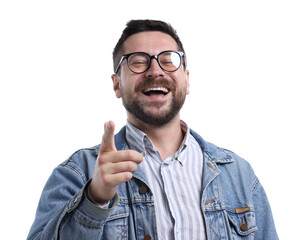 Handsome man laughing and pointing at something on white background. Positive emotion
