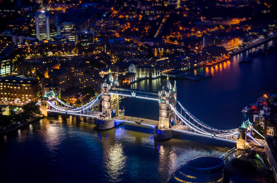 Illuminated Tower Bridge Over River Thames at Night in London - Powered by Adobe