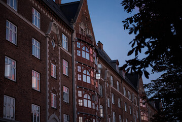 Evening light reflecting on historical brick buildings in a Copenhagen neighborhood