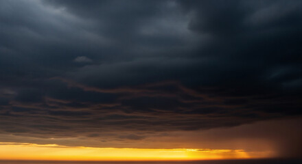 Dramatic Dark Storm Cloudscape Over Illuminated Horizon Scenery
