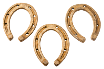 Three old rusty metal horseshoes isolated with transparent background