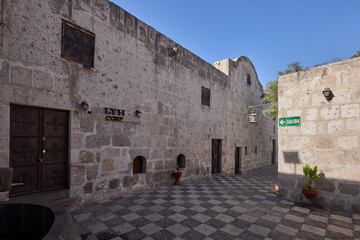 The Cloisters of the Company showcase elegant colonial architecture carved from white volcanic...