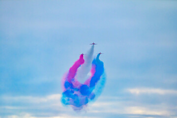 Blackpool, England - 10th August 2025: The Red Arrows performing an aerial display using red, white and blue smoke over the North Pier as part of the Blackpool Air Show