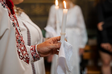 Orthodox Church Ritual with Candles: Traditional Eastern European Ceremony, Liturgical Celebration, White Robes, Red Embroidery, Soft Lighting