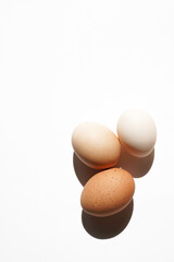 Country Living. Three Farm Free Range Eggs on White. Eggs for Breakfast.	                          ...