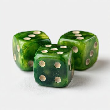 Three translucent green dice with off-white pips rest on a white background, showcasing a mottled, swirled effect in the green coloring