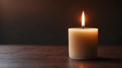 Small candle in dark minimal setting – moody and intimate lighting