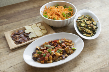 fresh mediterranean appetizers with cheese, eggplant,green  salad on wooden table