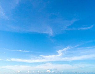 Obraz premium Clear blue sky with wispy clouds (1)