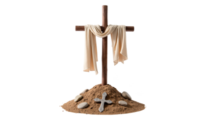 Wooden cross draped with fabric stands on mound of sand, surrounded by smooth stones, symbolizing faith and remembrance