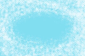 Fluffy white clouds or smoke forming an oval frame on a light blue background, with copy space.
