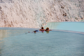 People resting in pamukkale terace pool - Pamukkale, Turkey