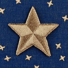 Embroidered Gold Star on Blue Fabric Detailed Closeup