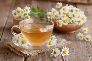 cup of chamomile tea with flowers
