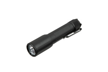 A small, black tactical flashlight with a pocket clip, on a white back