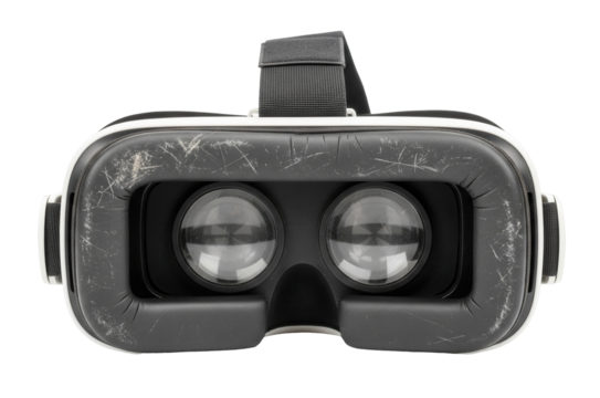 A black virtual reality headset with visible scratches and large lenses on a white background. Isolated transparent background (cut-out PNG file). Topics: virtual reality, technology, entertainment