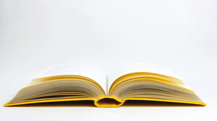 Fototapeta premium Open yellow book on white background with visible pages and cover details. Bookshop Day