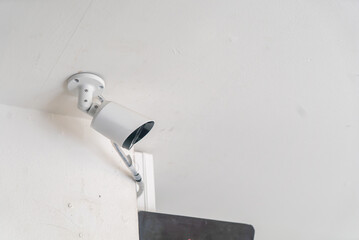 White Security Camera on Ceiling Mounting