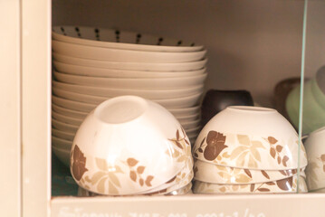 Elegant Dishware Arrangement in Cabinet