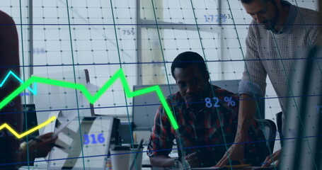 Collaborating analysts reviewing data on laptop at modern office, with overlaid digital charts