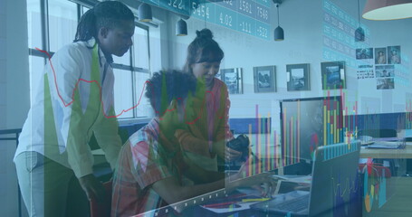 Collaborating teammates analyzing data overlay on laptop at office, with smartphone and documents