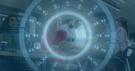 Handshaking colleagues in pink blouse and suit at conference table, with smartphone, wheelchair