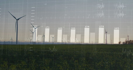 Showing large wind turbine spinning over green crops on farmland, with metric overlays, copy space