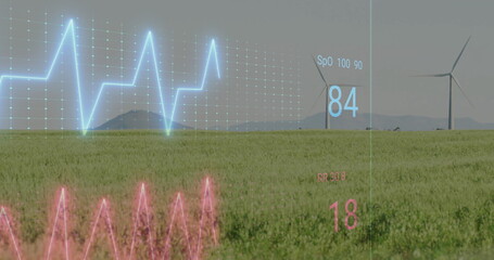 Projecting holographic ECG, SpO2 and PR readings over grass field at horizon, with wind turbines