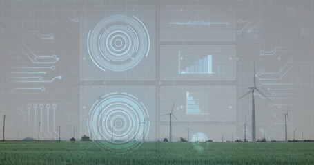 Displaying HUD overlay monitoring wind turbine performance above rural green field, data charts
