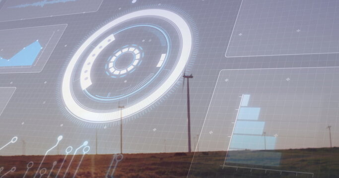 Displaying circular HUD overlay across rural grassland at dusk, with wind turbines and bar graph