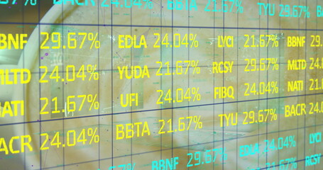 Transparent digital grid overlaying modern office conference room, with alphanumeric ticker symbols
