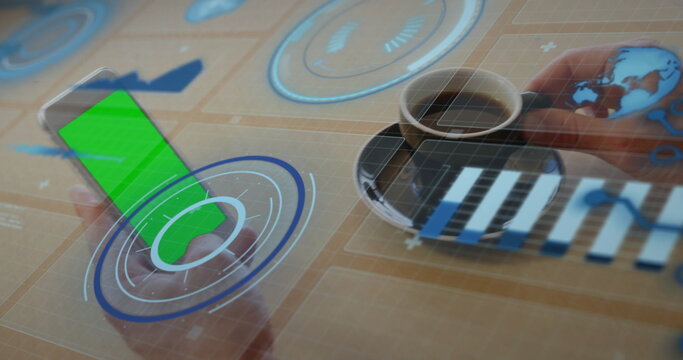 Hands manipulating floating analytics controls over smartphone on office desk, holding coffee cup
