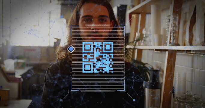 Projecting digital QR code overlay, bearded artisan crafting in maker studio, with ceramic vessels - Powered by Adobe