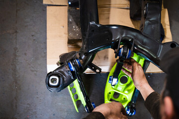 Control arms with polyurethane bushings installing process on drift car subframe. Installing drift...