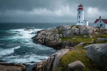 Obraz premium Majestic lighthouse standing on rocky coast during stormy weather in Nova Scotia near Atlantic Ocean