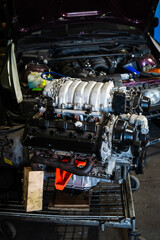 Engine Swap in Progress. Custom V8 engine prepared for installation in drift car. Highlighting...