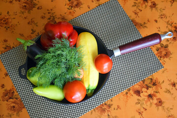 Set of different fresh vegetables in frying pan. Proper nutrition. Dietary menu. Top view.