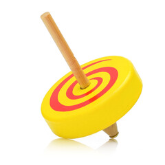 Yellow wooden toy spinning top on a white background.