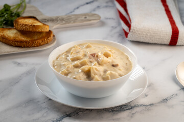 Bowl of soup with bread and extra bread