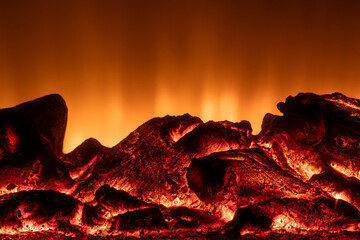 Fire burning in fireplace with rocks