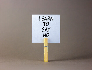 Learn to say no symbol. Concept words phrase Learn to say no on beautiful white paper on wooden...