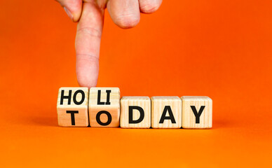 Today is holiday symbol. Concept word Today and Holiday on wooden cubes. Businessman hand. Beautiful orange table orange background. Business and today is holiday concept. Copy space.