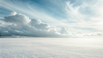 Obraz premium Expansive sky with dramatic clouds and a vast, bright horizon, creating a serene natural landscape