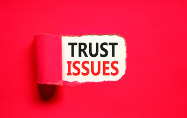 Trust issues symbol. Concept word Trust issues on beautiful white paper. Beautiful red paper background. Business trust issues concept. Copy space.